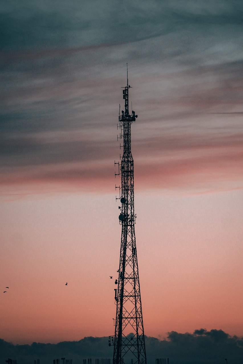 Image of a telecommunication tower at sunset