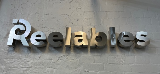 Picture of metal letters spelling the word Reelables